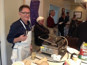 Chef Mark Peel serves up some of his famous grilled cheese sandwiches for the volunteers.